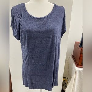 Blue short sleeve knit top with knotted detail on front side.
